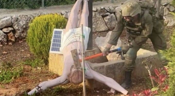 An Israeli soldier vandalized a statue of Jesus