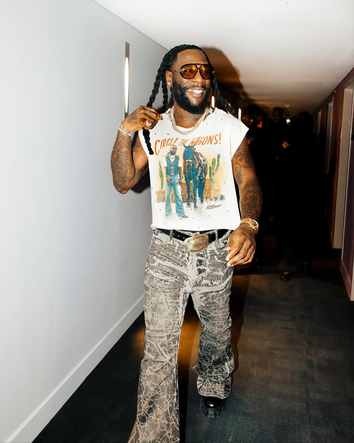 Burna Boy performing live on stage for the NFL Paris Game halftime show